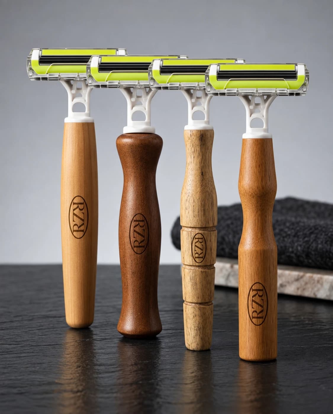 RZR razors with wooden handles of different woods and shapes, each laser-etched with the RZR mark